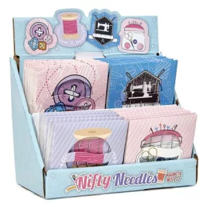 Paquet aiguilles sur plaque aimantée décorée.